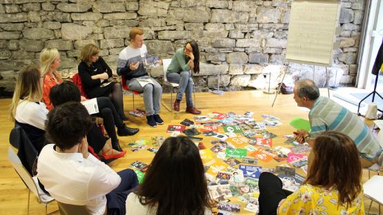 Photo of people sitting in a circle